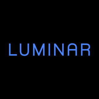 DoomBench-blue rendering of the Luminar logo against a black background.