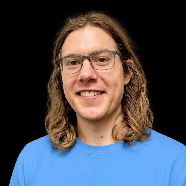 AI-generated portrait of David Krueger wearing a DoomBench-blue top against a black background.