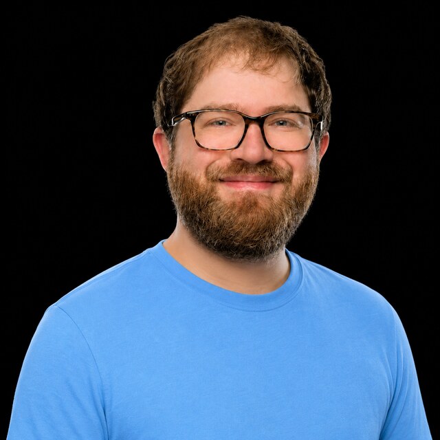 AI-generated portrait of Miles Brundage wearing a DoomBench-blue top against a black background.