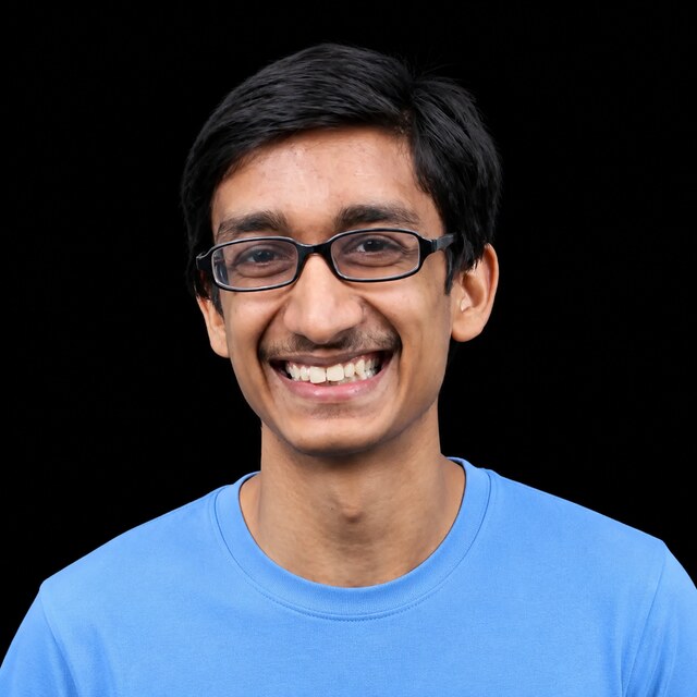 AI-generated portrait of Rohin Shah wearing a DoomBench-blue top against a black background.