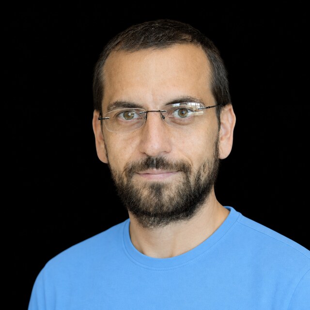 AI-generated portrait of Roman Yampolskiy wearing a DoomBench-blue top against a black background.