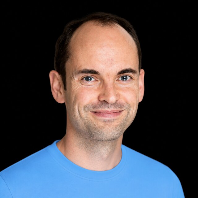 AI-generated portrait of Toby Ord wearing a DoomBench-blue top against a black background.